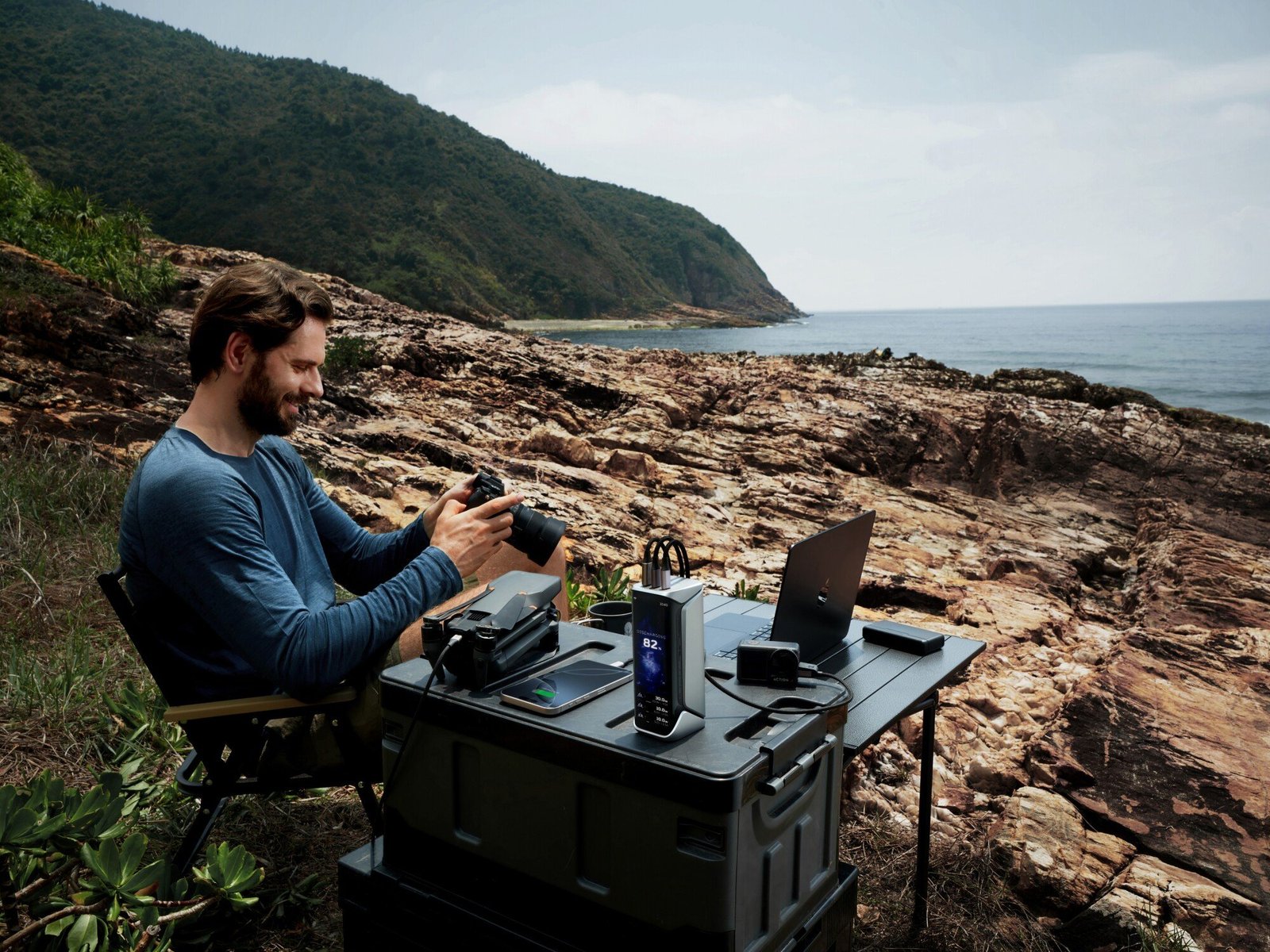 a person works outside with the ecoflow pro X power station