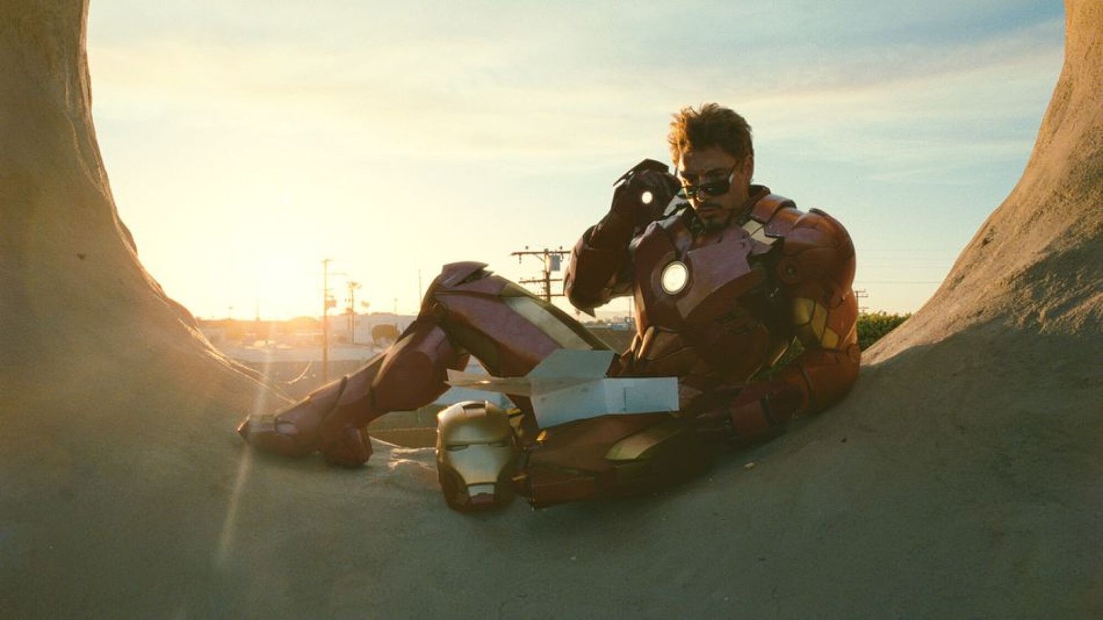 images-473-fill_-size_2000x1124-v1631049911 Robert Downey Jr. as Iron Man, metal suit and all, reclining with some doughnuts.