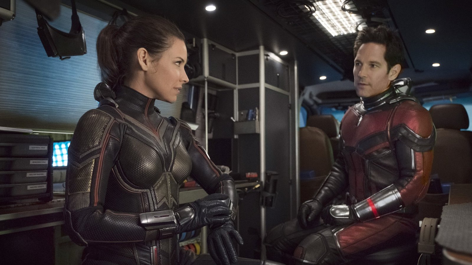 images-489-fill_-size_2000x1125-v1631049913 Hope (Evangeline Lilly) and Scott (Paul Rudd) talk while wearing futuristic metal armor.