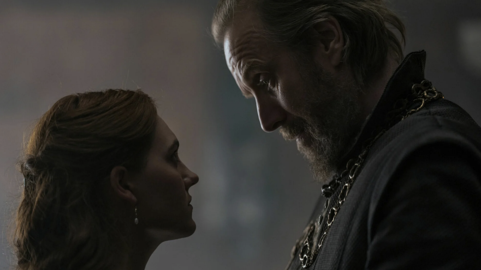 images-9-fill_-size_2000x1123-v1715957012 A man looks down at a younger woman in a dark room.