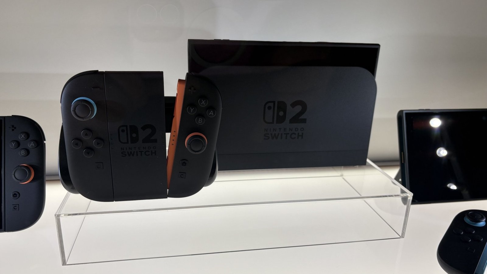 nintendo switch 2 with controllers on glass display case